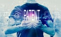 Patent concept with man holding smartphone Royalty Free Stock Photo