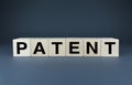 Patent. Cubes form the word Patent