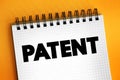 Patent is an exclusive right granted for an invention, text concept on notepad