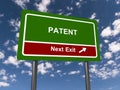 patent next exit traffic sign on blue sky Royalty Free Stock Photo