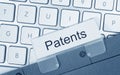 Patents - folder with text on computer keyboard