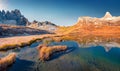 Paterno peak reflected in the Calm waters of Piani lake. Bright autumn view of Dolomite alps