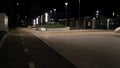 Path through city park at night with street lamps. Stock footage. Late evening alley in the park with street lights and Royalty Free Stock Photo