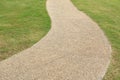 Path curving through green grass. Royalty Free Stock Photo