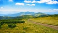 path down the green slope. mountainous landscape in summer on a sunny day Royalty Free Stock Photo