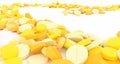 Path filled with yellow pills on a white background