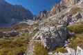 Path at the foots of of rocky ridges of Cima Undici Mountain in Comelico region Royalty Free Stock Photo