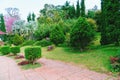 The path in the garden. pathway in the park, curve walkway on green grass field. courtyard and walkway in the park. Royalty Free Stock Photo