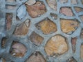 The path in the garden. walkway with stones, rough stone walkway with concrete