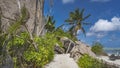 A path goes along the beach on a tropical island. Royalty Free Stock Photo