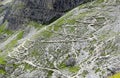 path high in the Alps on zigzag slopes without people
