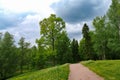 Path in a hilly green park. Spring landscape. Royalty Free Stock Photo