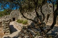 Path and huts made of stone under sunny blue sky, in the Village of Bories, near Gordes. Royalty Free Stock Photo