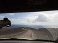 Path leading to the ocean, car window view. to the uncertain future, ready for adventure and new challenges. unbeaten path