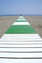 Path leading to sandy beach and sea