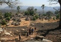 People walking on a path and discovering a small rural village of Kedougou region in senegal