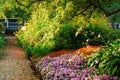 A path leads through a lovely colorful garden