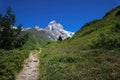 Path in the mountains. Mount Ushba, Main Caucasian ridge