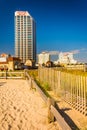 Path over sand dunes and buildings along the boardwalk in Atlantic City, New Jersey.