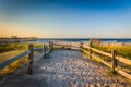 Path over sand dunes to the Atlantic Ocean at sunrise in Ventnor