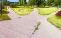 The path in the park is divided into three alleys going in different directions. Conceptual summer landscape Royalty Free Stock Photo