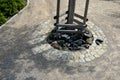 Path in a park tree planted in a circle of cobblestone granite cubes stacked in a circle. gravel beige threshing path