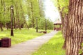 Path in the park, which leads to the gazebo. Beautiful park with trees, lanterns and gazebo. Royalty Free Stock Photo