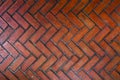 The path paved with red brick in herringbone pattern, Red stone walkway herringbone style pattern Royalty Free Stock Photo