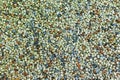 A path paved with small colored pebbles. Texture Royalty Free Stock Photo