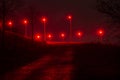 Path on the Rheinpreussen dump near Moers, to the mining lamp, bathed in ruby red light