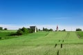 The path in ripening cereal leads across the hill. Natural landscape