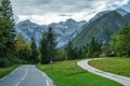 Path and Road, Meadow and Forest, Julian Alps in the Background, Slovenia Royalty Free Stock Photo