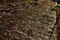 Path of stacked stones, red bricks lined up standing. burnt bricks strengthen the slope under the bridge. An early morning. paving