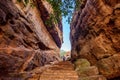Path through steep cliffs, Entrance for lower and upper Shivalaya in Badami, Karnataka, INDIA Royalty Free Stock Photo