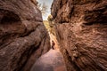 Path through steep cliffs, Entrance for lower and upper Shivalaya in Badami, Karnataka, INDIA Royalty Free Stock Photo