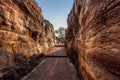 Path through steep cliffs, Entrance for lower and upper Shivalaya in Badami, Karnataka, INDIA Royalty Free Stock Photo