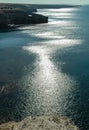 A path of sun glare on the water against the blue sky near the rocks on Tarkhankut, Atlesh Royalty Free Stock Photo