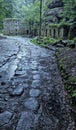 Path to the broken mill remains in the rain Royalty Free Stock Photo