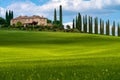 Path to hill house through cypress trees and sunrise view of stunning rural landscape of Tuscany, Italy