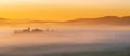 Path to hill house through cypress trees and sunrise view of stunning rural landscape of Tuscany, Italy