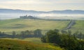 Path to hill house through cypress trees and sunrise view of stunning rural landscape of Tuscany, Italy