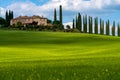 Path to hill house through cypress trees and sunrise view of stunning rural landscape of Tuscany, Italy