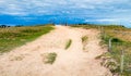 Path to sand beach with beachgrass. Way to the wide sandy beaches of the Atlantic. Royalty Free Stock Photo