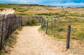 Path to sand beach with beachgrass. Way to the wide sandy beaches of the Atlantic. Royalty Free Stock Photo