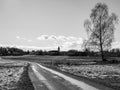 Path to Schrems fields church background birch winter black white artistic view Royalty Free Stock Photo