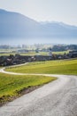 Path to Austrian mountain village with foggy valley background during fall in Wildermieming, Tirol, Austria Royalty Free Stock Photo