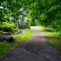 Path to walk through the public park with leafy trees next to St. Machar's Cathedral, Aberdeen.