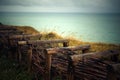 Path at the Top of the Cliffs at Fecamp Normany with wooden fence and barbed wire