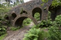 Path under seven arched bridge at Rivington Terraced Gardens