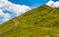 Path uphill to the peak of mountain ridge